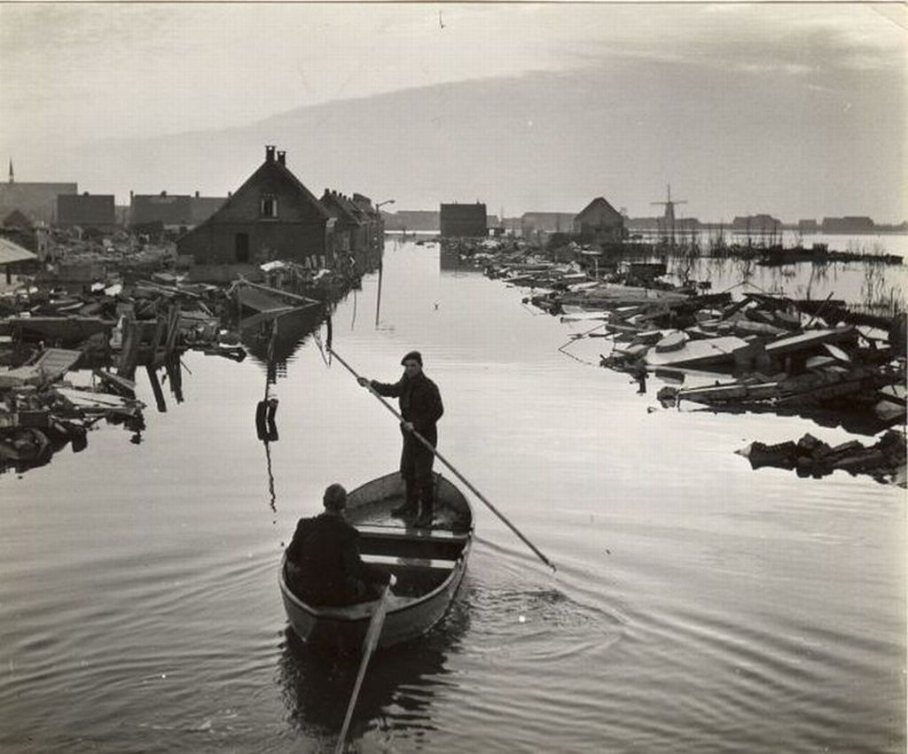 Whitney leaning against a railing on a downtown street